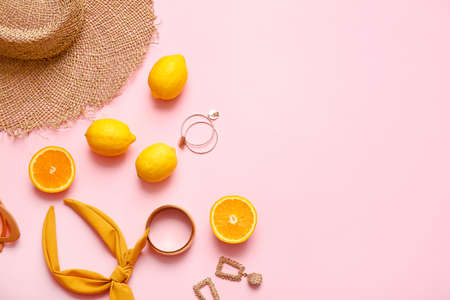 Set of female accessories and citrus fruits on color backgroundの写真素材