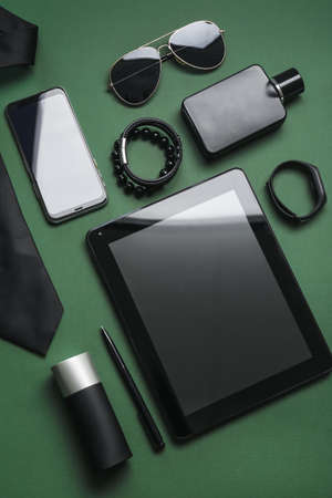Stylish accessories, tablet computer, mobile phone and smartwatch on color backgroundの写真素材
