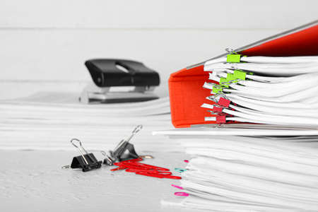 Stack of folders with documents on table