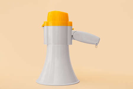 Modern megaphone on color background