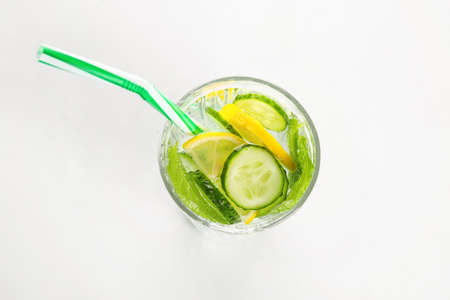 Glass with cucumber lemonade on white backgroundの写真素材