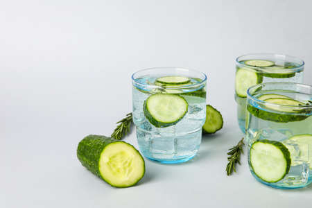 Glasses with cucumber lemonade on light backgroundの写真素材