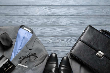 Set of stylish male accessories on dark wooden backgroundの写真素材