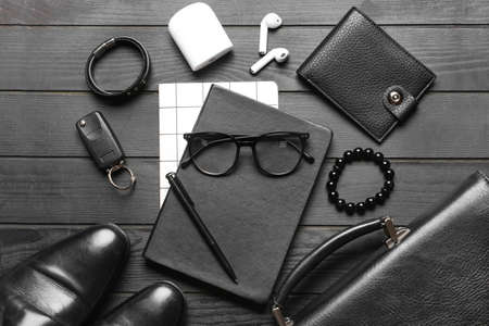 Set of stylish male accessories on dark wooden backgroundの写真素材