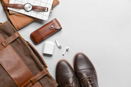 Set of stylish male accessories and clothes on gray background