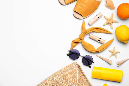 Set of beach accessories on white background