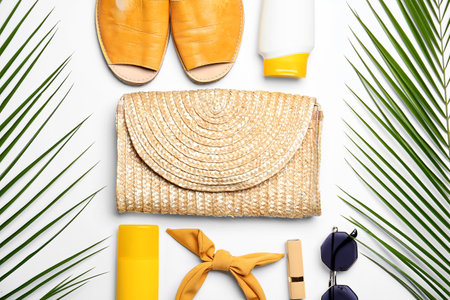 Set of beach accessories and palm leaves on white background, closeupの写真素材
