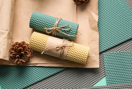 Handmade wax candles on tableの写真素材