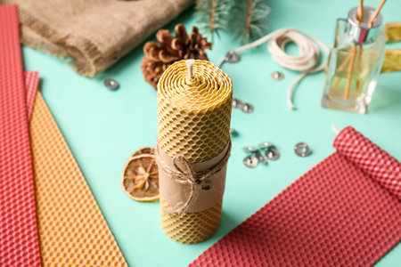 Handmade wax candle on color backgroundの写真素材