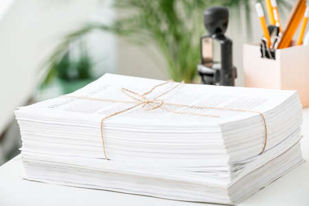 Stack of documents on table in office, closeupの写真素材
