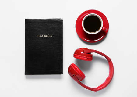 Holy Bible, cup of coffee and modern headphonesの写真素材