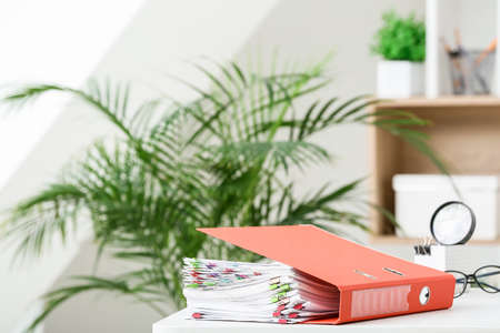 Stack of documents on table in officeの写真素材