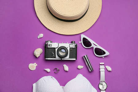 Set of beach accessories on color backgroundの写真素材