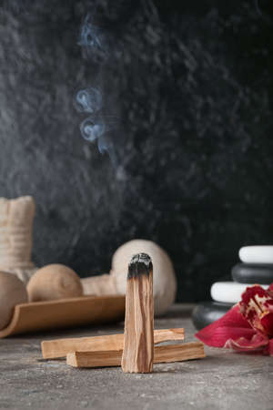 Palo Santo and spa supplies on tableの写真素材