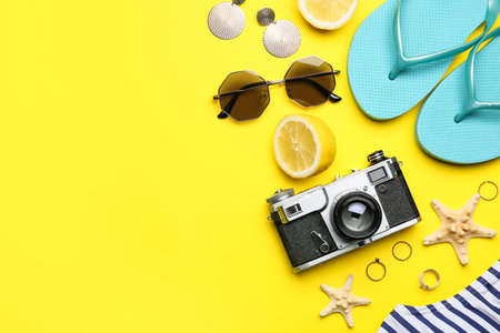 Set of beach accessories and lemon on color backgroundの写真素材