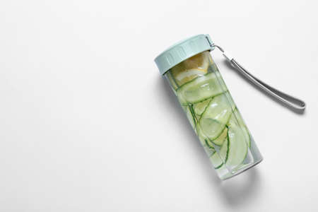 Bottle with cucumber lemonade on white backgroundの写真素材