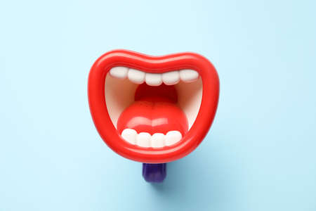 Toy megaphone on blue backgroundの写真素材