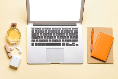 Laptop, notebooks and accessories on color backgroundの写真素材