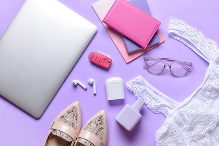 Composition with different female accessories and laptop on color backgroundの写真素材