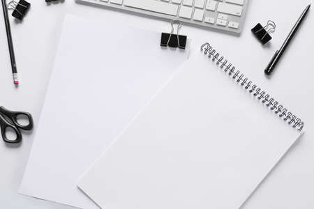 Blank notebook, sheet of paper and stationery on white background, closeupの写真素材