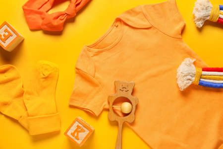 Baby clothes, toys and headband on color background, closeupの写真素材