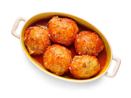 Baking dish with delicious meatballs and melted cheese on white backgroundの写真素材
