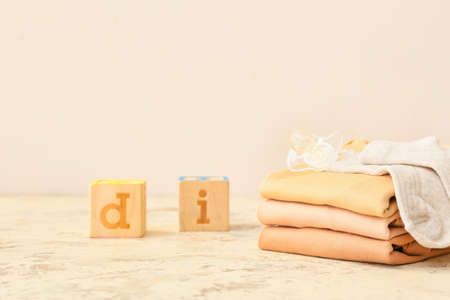 Set of baby clothes and accessories on color backgroundの写真素材