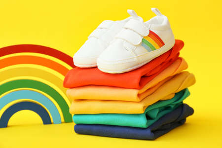 Set of baby accessories and shoes on color backgroundの写真素材