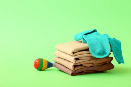 Set of baby clothes and accessories on color backgroundの写真素材