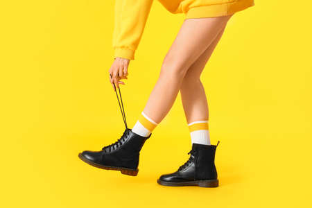 Stylish young woman on color backgroundの写真素材