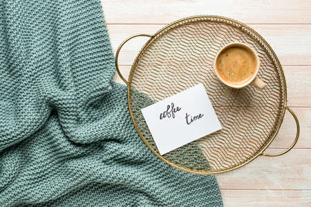 Tray with cup of coffee and sheet of paper with text COFFEE TIME on wooden backgroundの写真素材