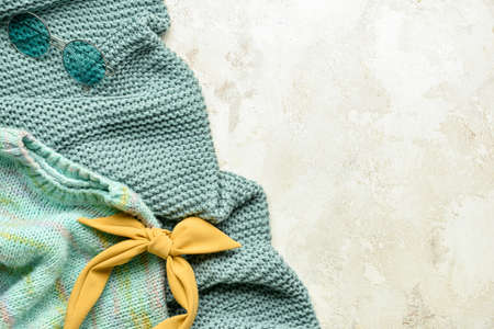 Woolen sweater, glasses and headband on color backgroundの写真素材