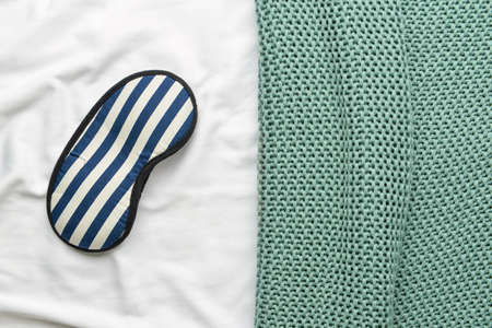 Stylish sleep mask on fabric backgroundの写真素材