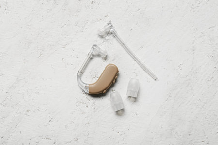 Hearing aid with accessories on white backgroundの写真素材