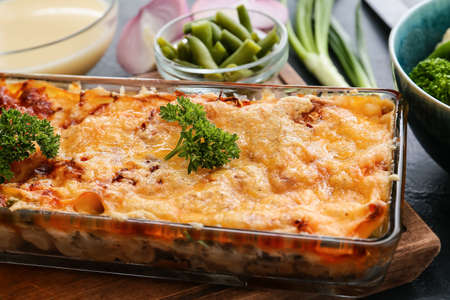Baking dish with tasty vegetable lasagna on table, closeupの写真素材