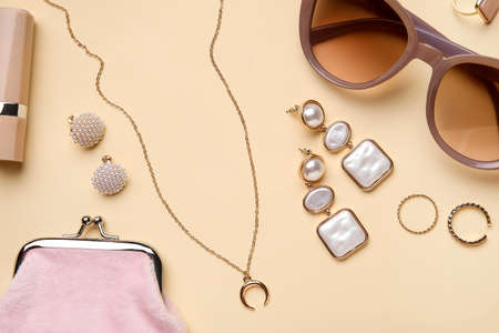 Set of female accessories on color background, closeup