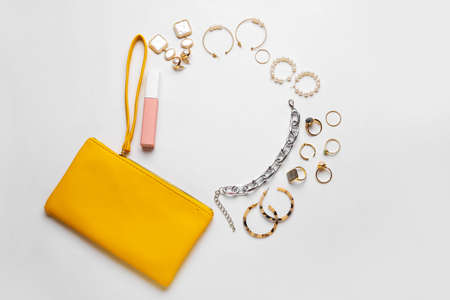 Set of female accessories on white background