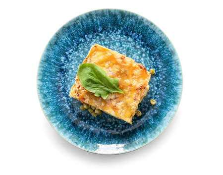 Plate with tasty vegetable lasagna on white background
