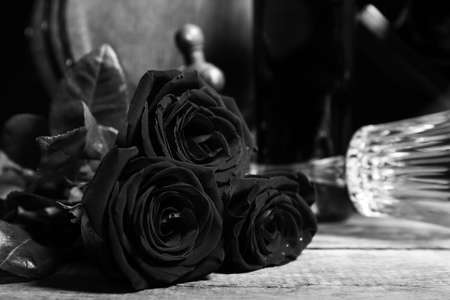Beautiful roses on wooden table, closeupの写真素材