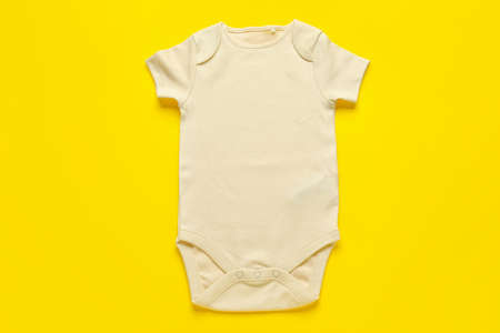 Baby clothes on color backgroundの写真素材
