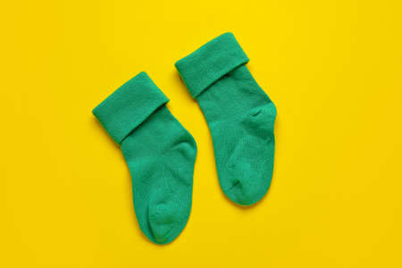 Baby socks on color backgroundの写真素材