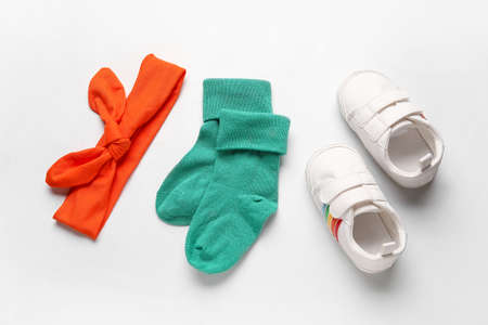Baby shoes and socks on white backgroundの写真素材
