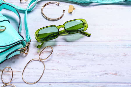 Stylish female accessories on white wooden backgroundの写真素材
