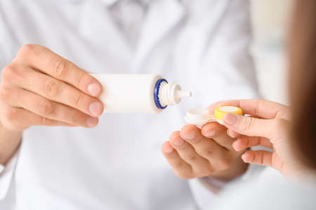 Ophthalmologist working with patient in clinic