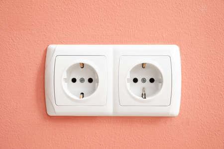 Electric socket on color wall