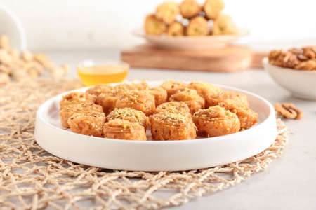 Tray with delicious baklava on table