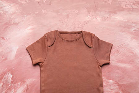 Baby clothes on color backgroundの写真素材