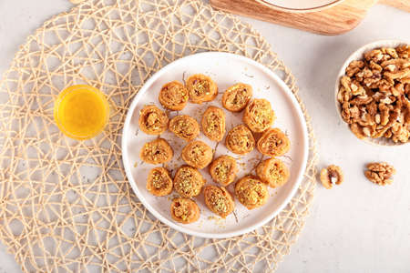 Tray with delicious baklava on light backgroundの写真素材