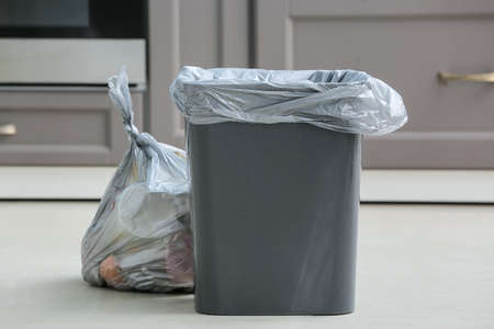 Bag with garbage and rubbish bin in kitchenの写真素材
