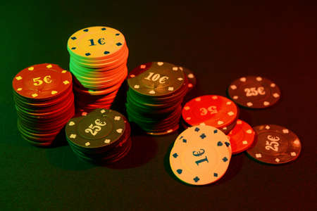 Poker chips on dark background